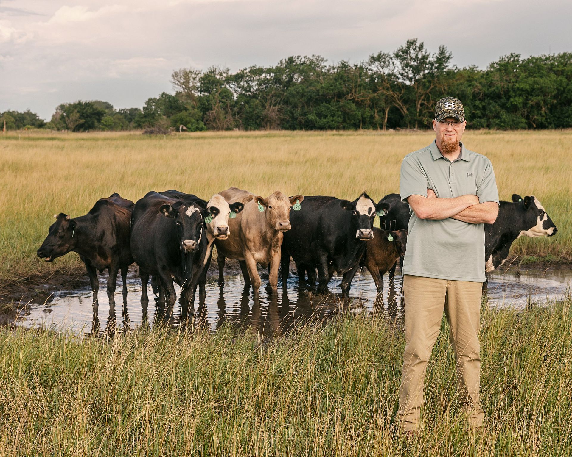 Personal Brand Photo in morning blue hour in front of cattle farm mini session Burrton KS photographer Sara McMillian
