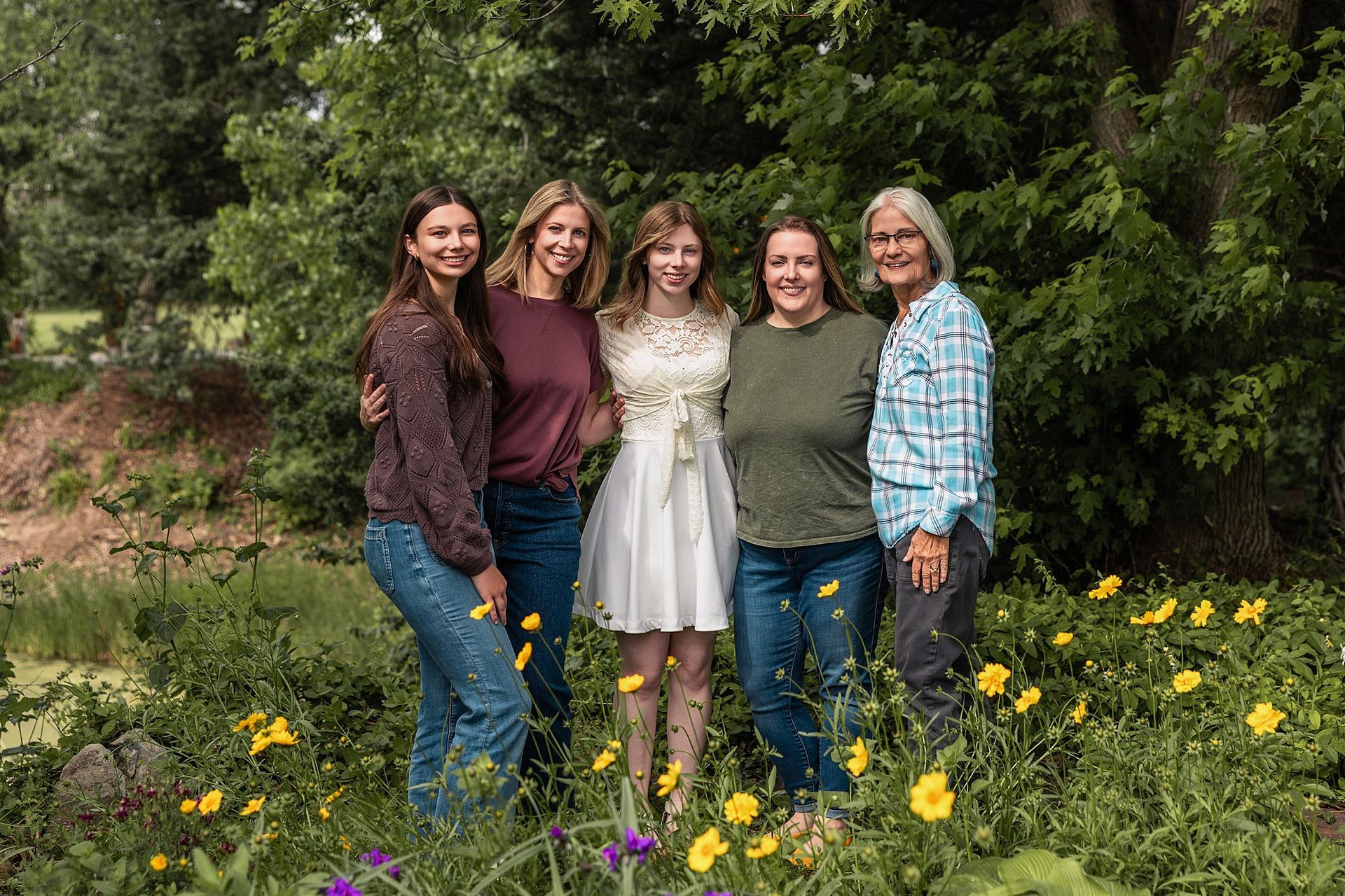Mother laughing with her daughters under prairie sunset extended family mini session Burrton KS Sara McMillian