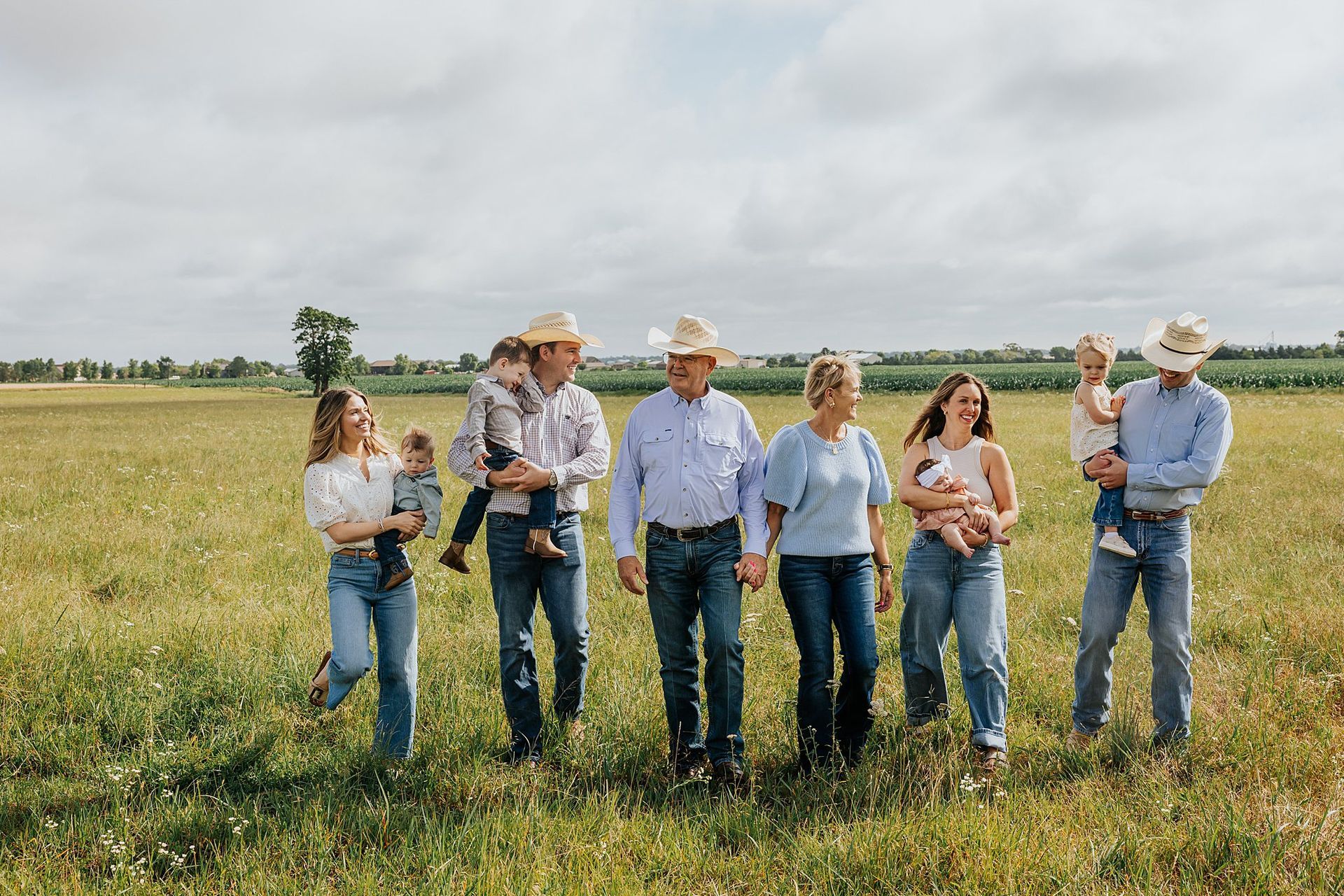 Grandparents with young kids and older sons in cowboy hats rustic family session Andale KS Sara McMillian
