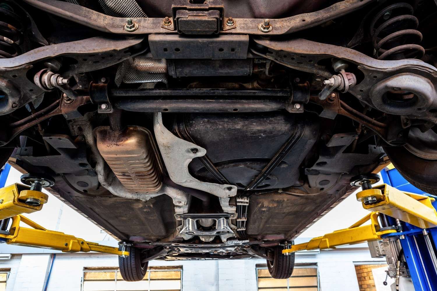 Underside of A Car on A Lift — Woden Automotive Services in Phillip, ACT
