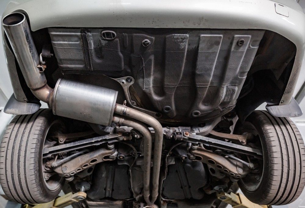 An Underside of A Car Showing the Exhaust System — Woden Automotive Services in Phillip, ACT