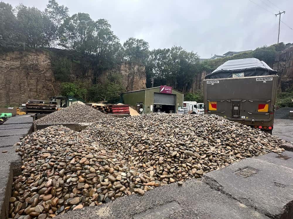 A Pile Of Gravel Is Sitting Next To A Truck In A Parking Lot — Burnetts On Barney in Jamberoo, NSW