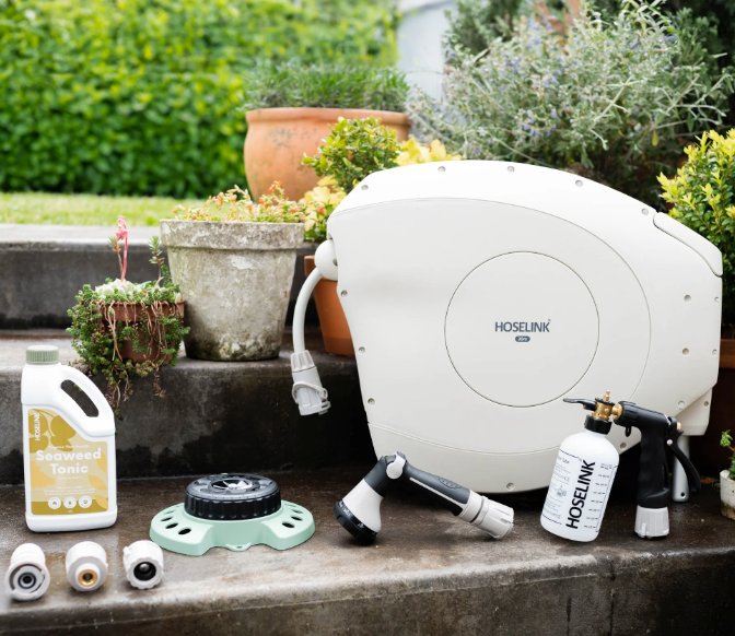 A Group of Purple and White Flowers in Buckets — Burnetts On Barney in Kiama, NSW