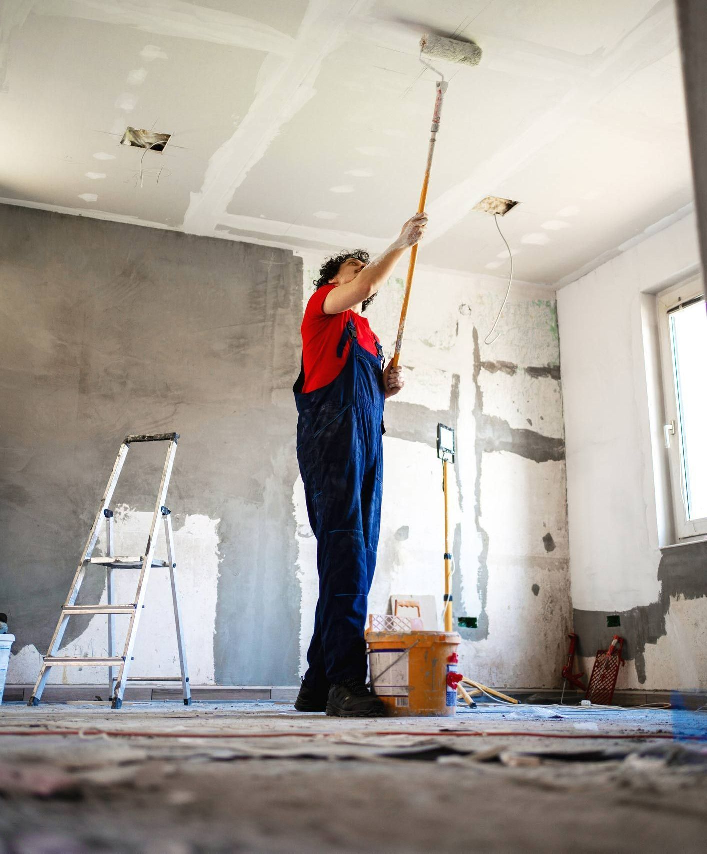 Worker painting apartment walls | Broome, WA | Perkins Painting