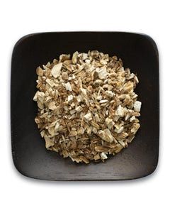 A black bowl filled with chopped mushrooms on a white background.