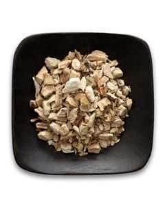 A black plate topped with a pile of chopped mushrooms on a white background.