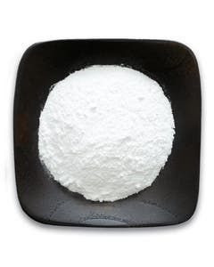 A black plate topped with a pile of white powder.