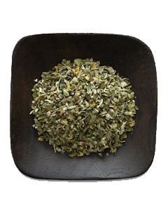 A wooden bowl filled with dried herbs on a white background.