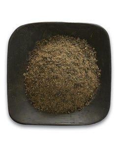 A black bowl filled with a pile of powder on a white background.