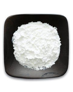 A black plate topped with a pile of white powder.