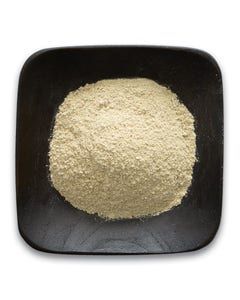 A black bowl filled with white powder on a white background.