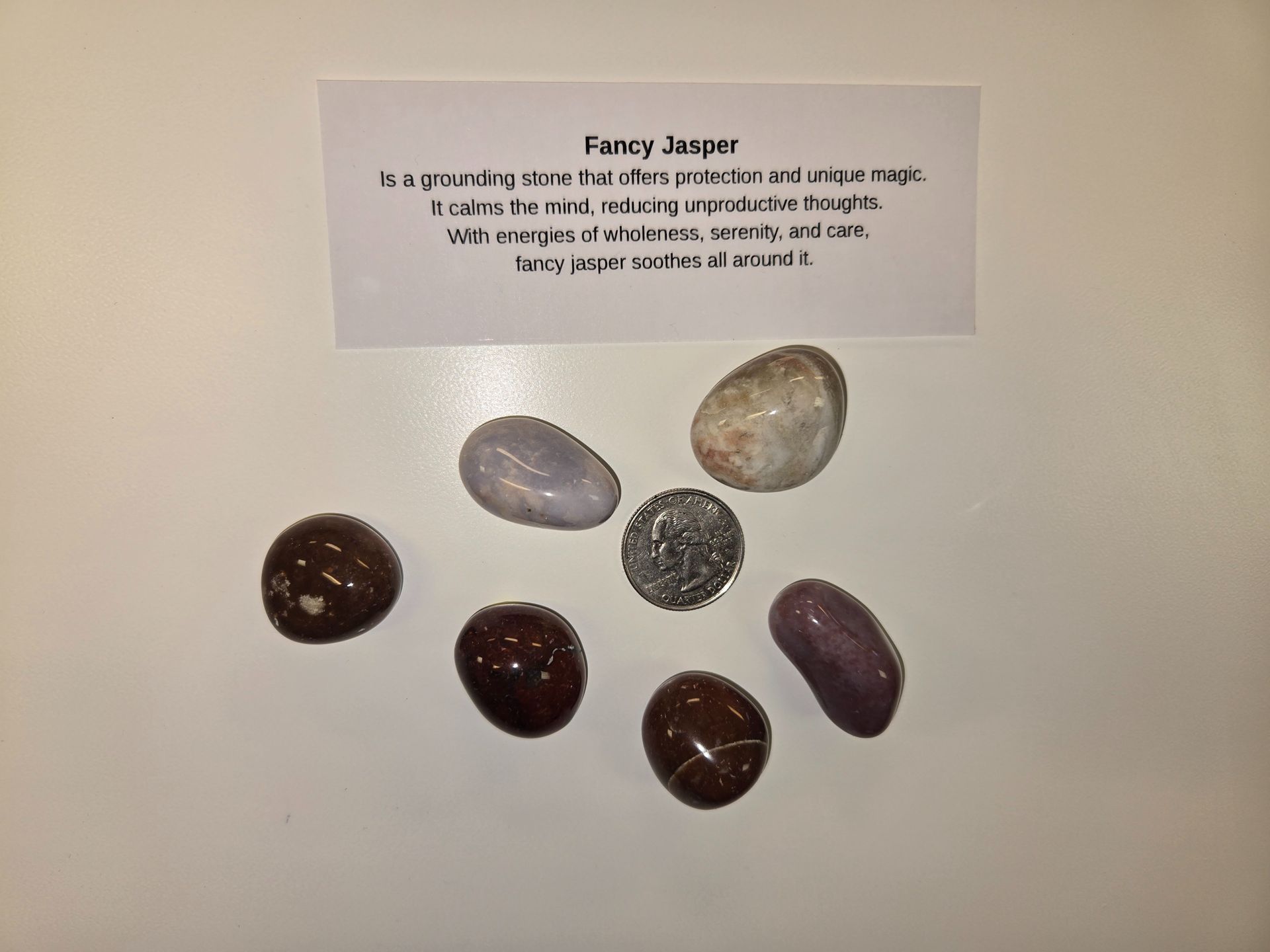 A group of rocks with a card that says fancy jasper