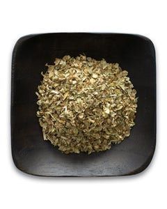 A black bowl filled with dried herbs on a white background.