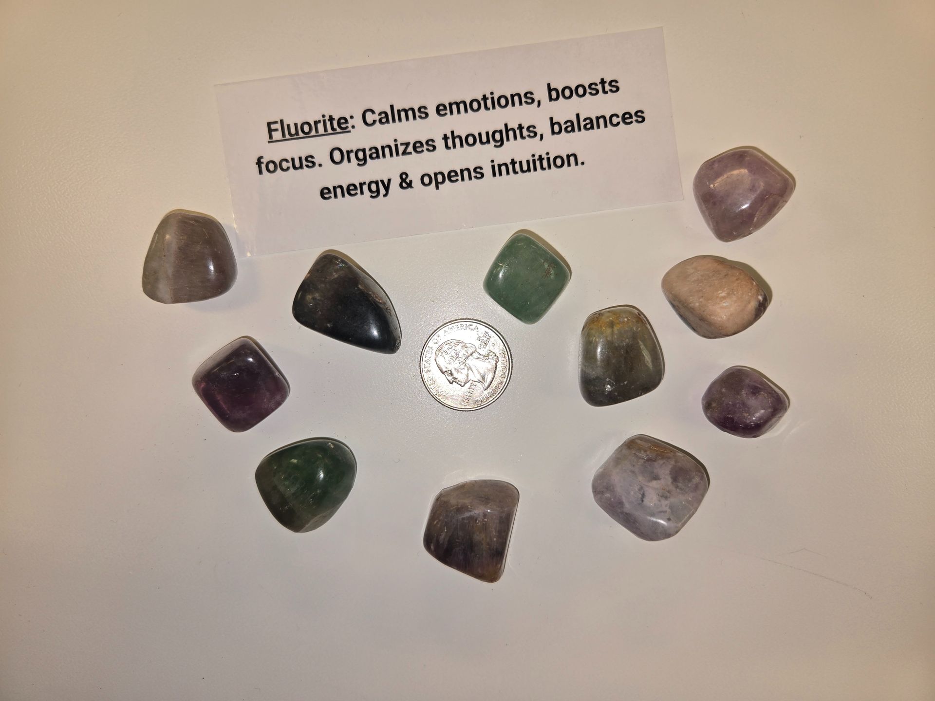 A group of crystals with a card that says " elverite " on it