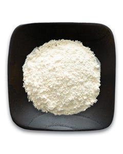A black bowl filled with white powder on a white background.