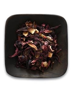 A square bowl filled with dried flowers on a white background.