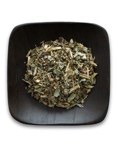 A wooden bowl filled with dried herbs on a white background.