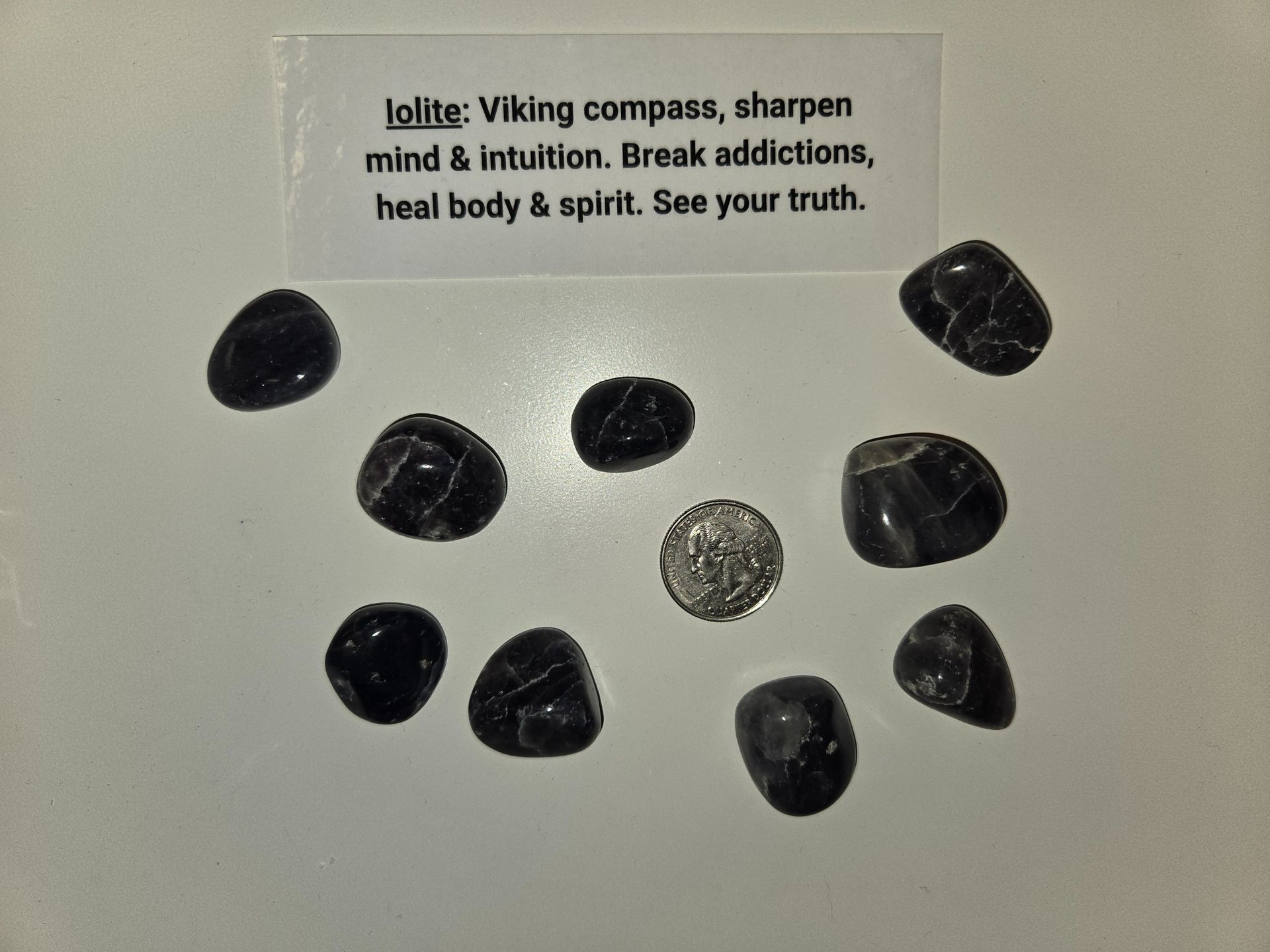 A sticker that says lolite viking compass sharpen mind & intuition break addictions heal body & spirit