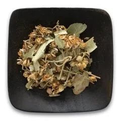 A black square plate topped with dried flowers and leaves.