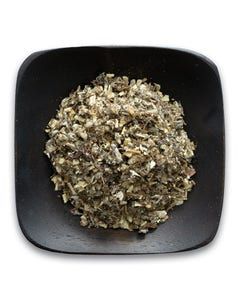 A black bowl filled with dried herbs on a white background.