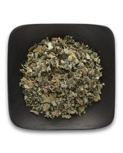 A black square bowl filled with dried herbs on a white background.
