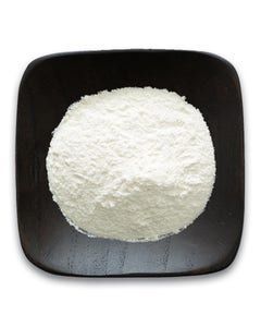 A black plate topped with a pile of white powder.
