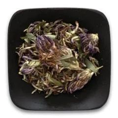 A black square plate topped with dried flowers and leaves.