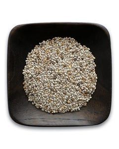 A wooden bowl filled with chia seeds on a white background.