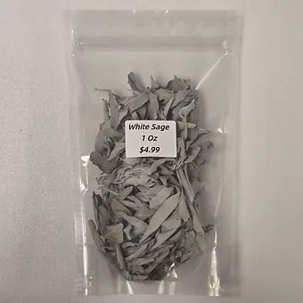 A bag of white sage is sitting on a table.
