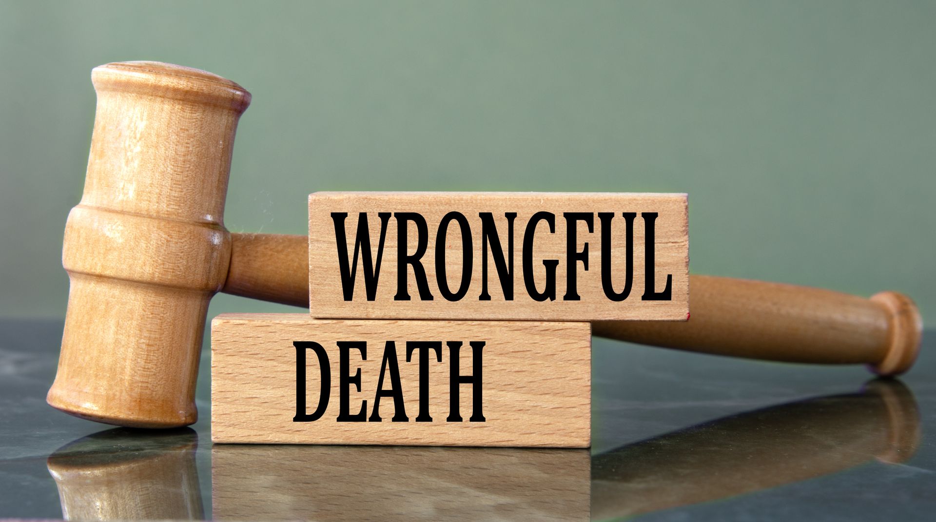 Wrongful death attorney concept with judge’s gavel and wooden blocks displaying wrongful death text. Wrongful death attorney concept with judge’s gavel and wooden blocks displaying wrongful death text.