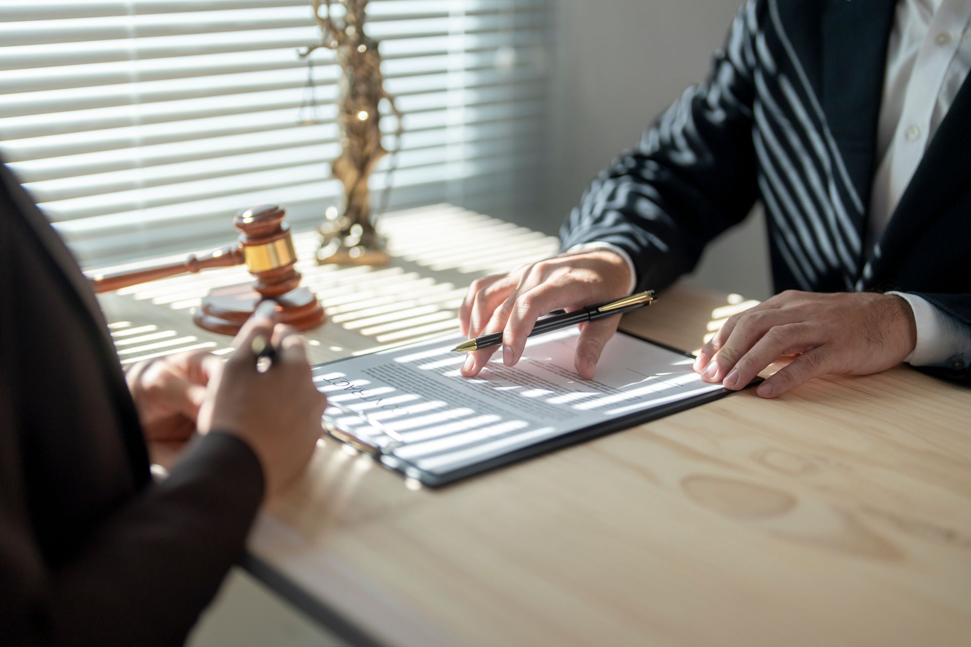 A lawyer is explaining a legal document to a client.