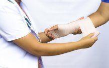 Injured Hand —Nurse Putting Bandage in Marlton, NJ