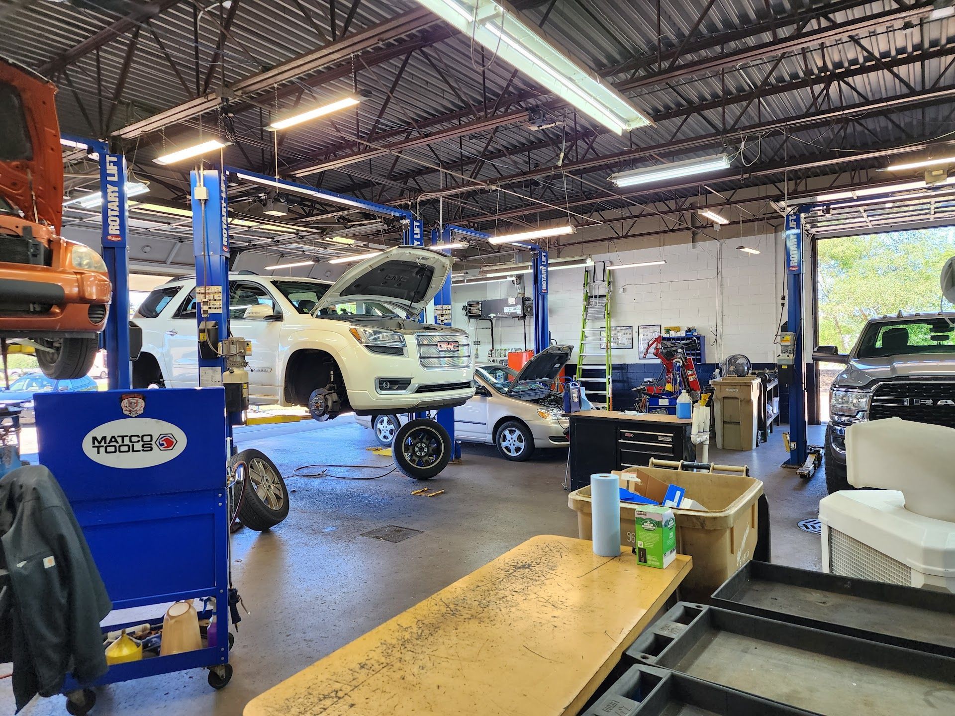 Vehicles Being Repaired in Automotive Shop | Auto Centric