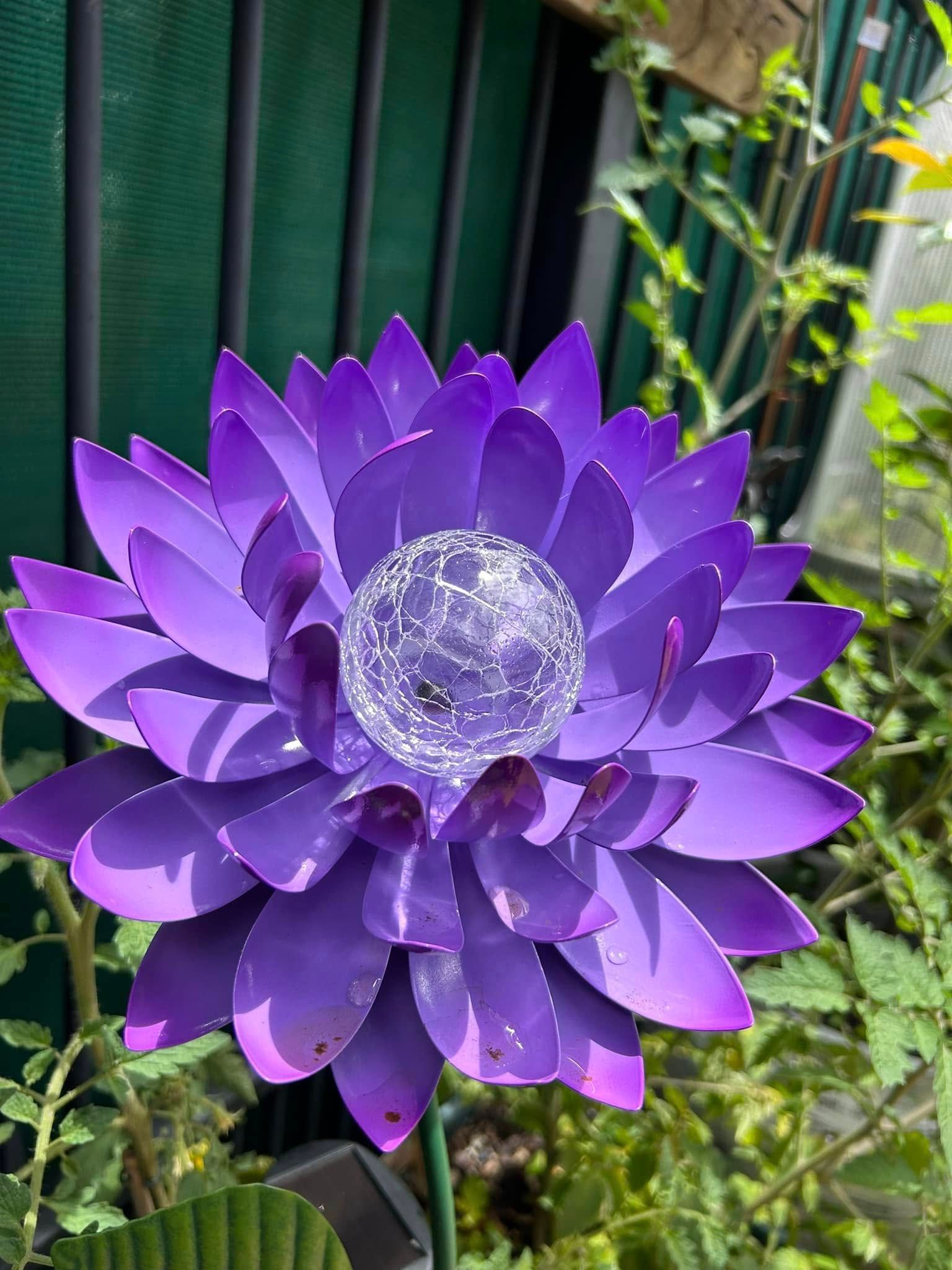 Purple Metal Flower Decoration With a Clear Globe Center, in a Garden — Hinterland Foliage in Landsborough, QLD