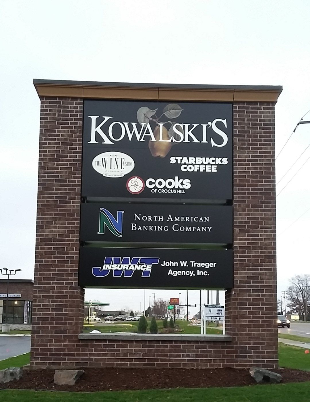 Sign with business names: Kowalski's, Starbucks Coffee, Cooks, North American Banking Company, and John W. Truman Agency, Inc.
