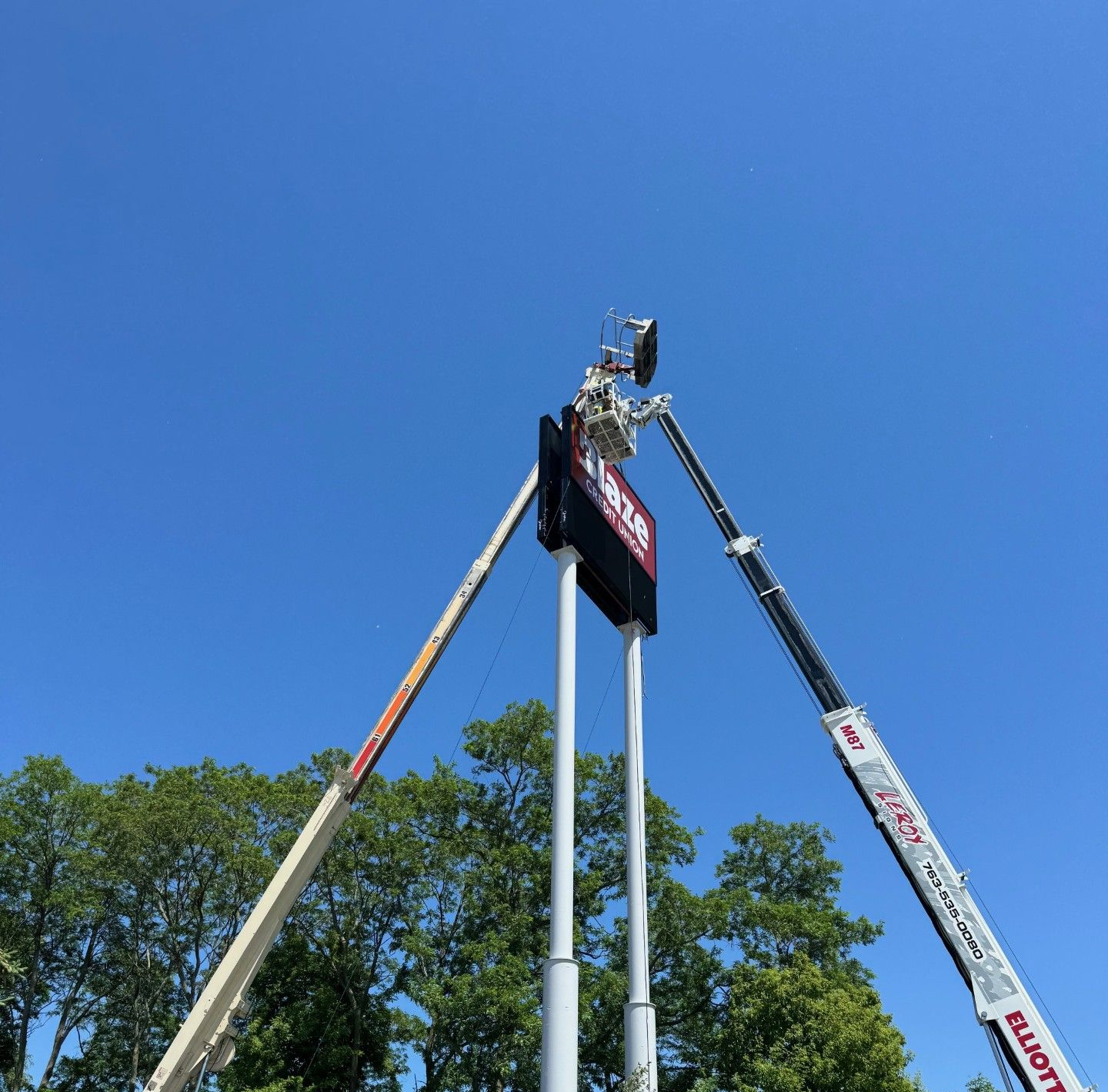 Sign for Community Based Outpatient Clinic, white letters on blue, inside a workshop. Sign for Community Based Outpatient Clinic, white letters on blue, inside a workshop.