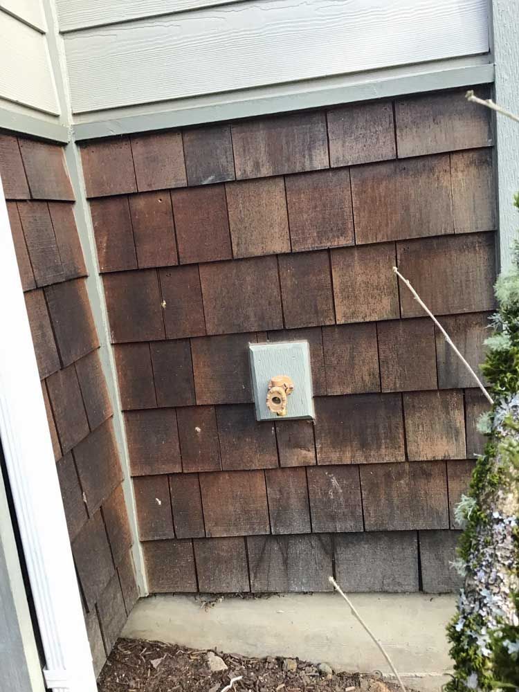 A close up of a wooden siding on a house