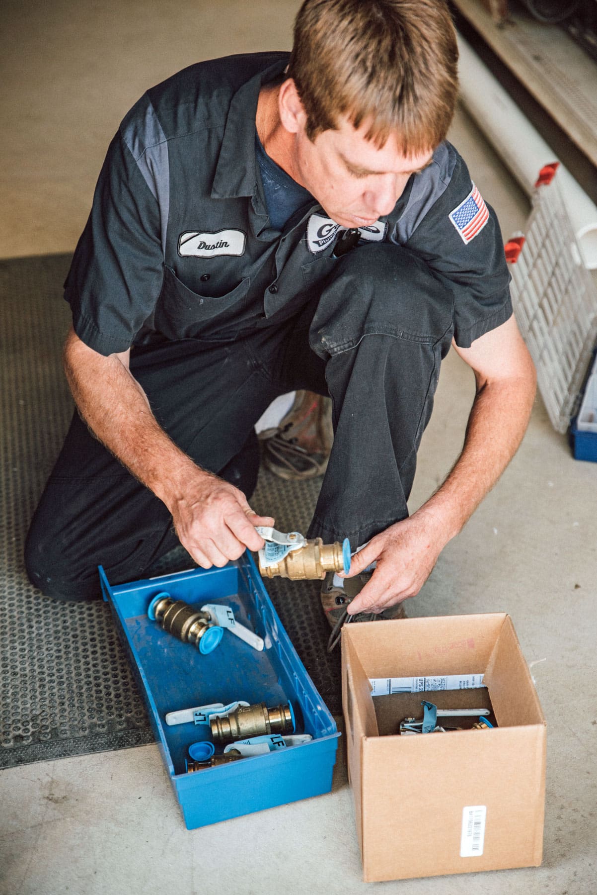 Photo of a plumber repairing a boiler