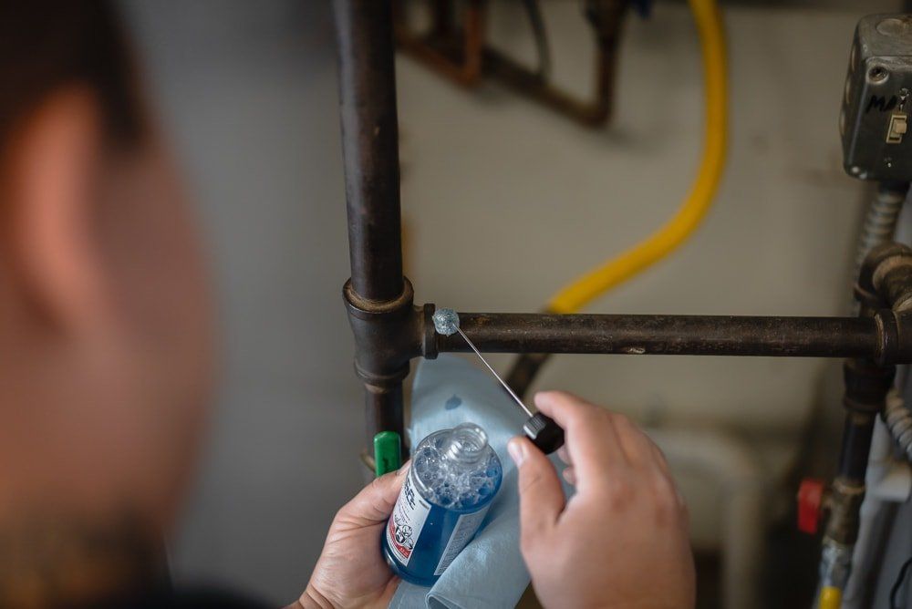 Photo of a plumber installing a gas line