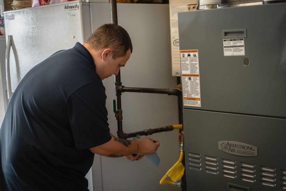 Photo of a plumber installing a gas line