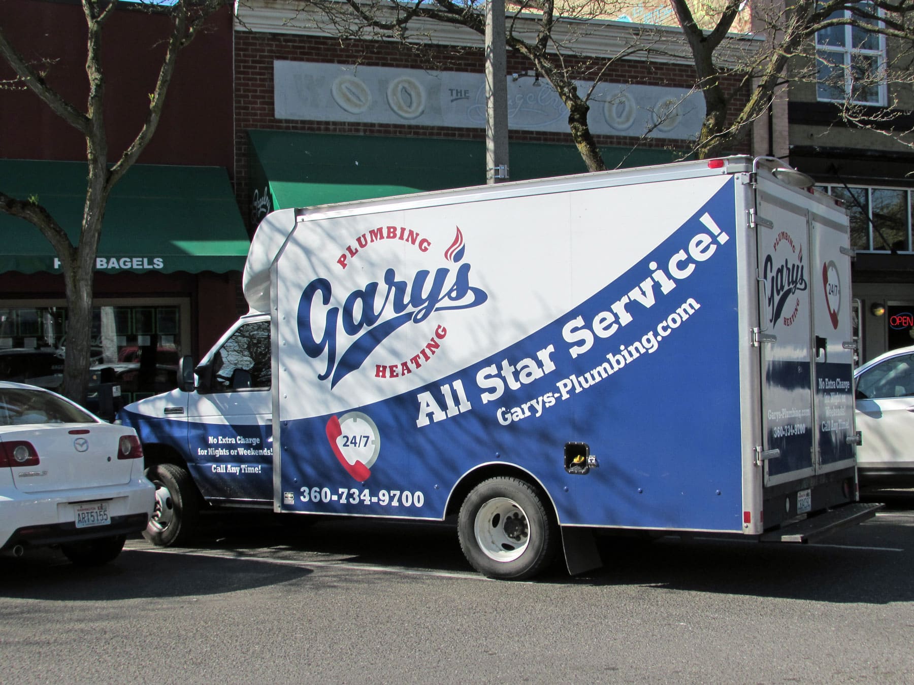 A blue and white van that says gary 's all star service