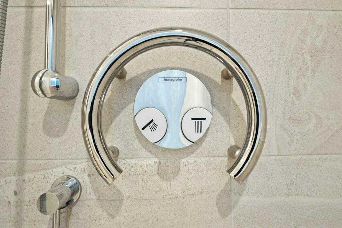 Shower controls with a semi-circular grab bar and two buttons with showerhead and temperature icons.