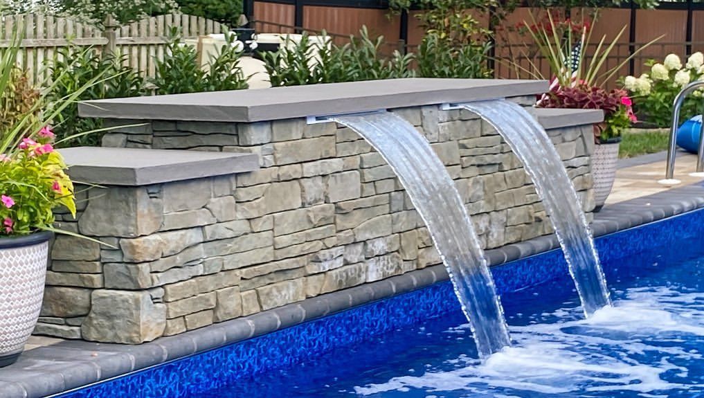 A large swimming pool is surrounded by a wooden deck with a table and chairs.