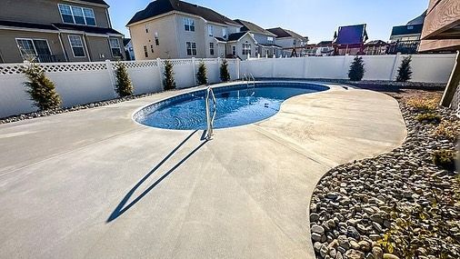 A house with a swimming pool and a wooden deck