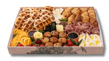 A box filled with a variety of food on a white background.