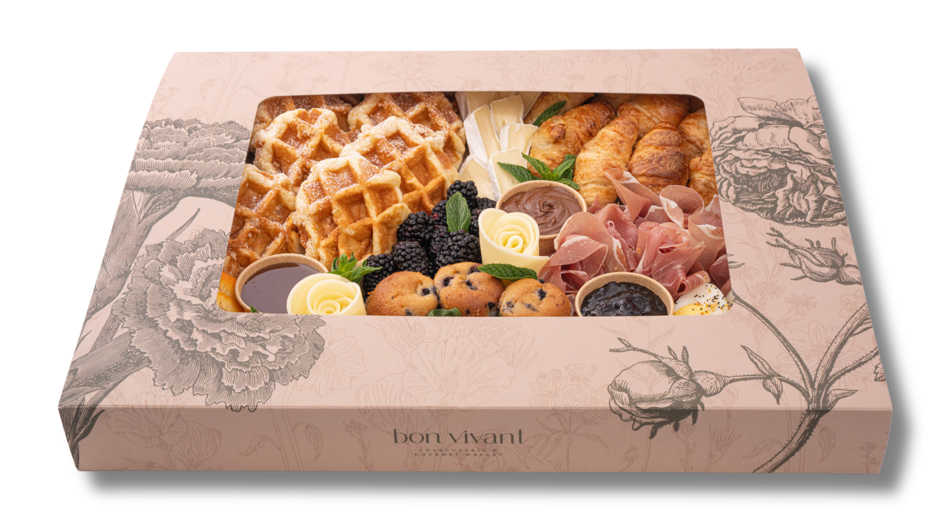 A box filled with a variety of food including waffles and croissants.