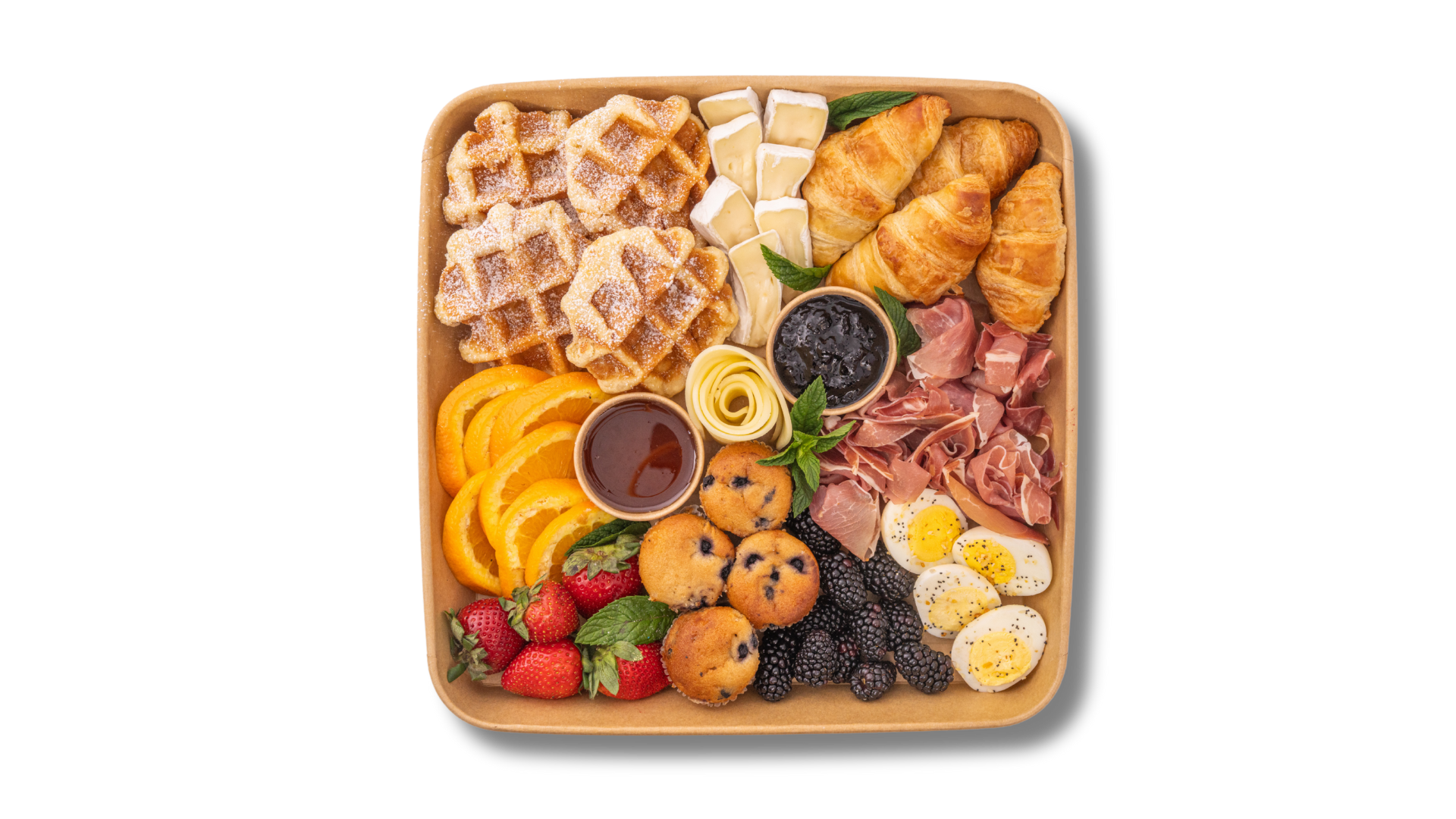 A wooden tray filled with a variety of food on a white background.