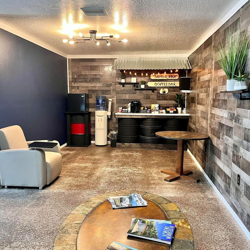 A living room with a table , chairs , and a coffee table.