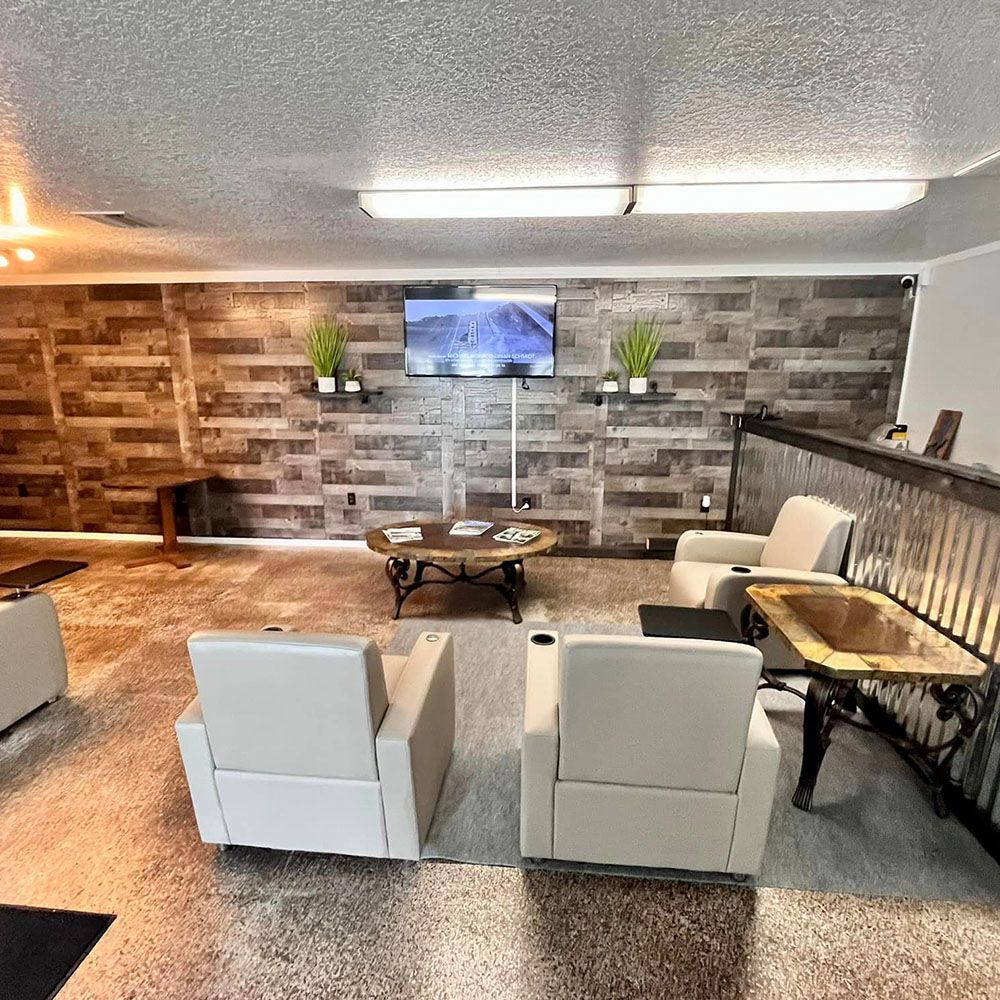 A living room filled with furniture and a television.