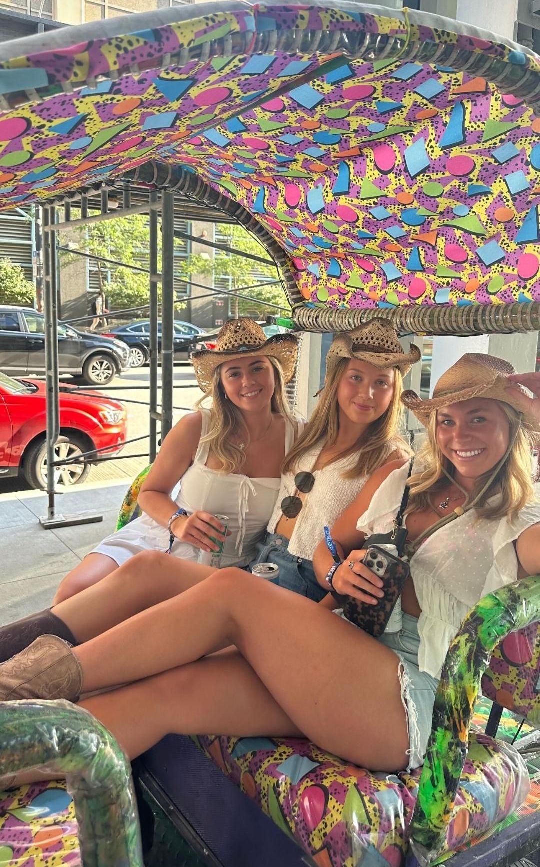 Our chicago pedicab tours are perfect for group celebrations, like this trio in cowboy hats enjoying a fun chicago rikshaw ride.